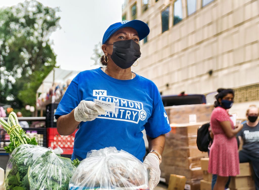 Woman with NYCP shirt and baseball cap